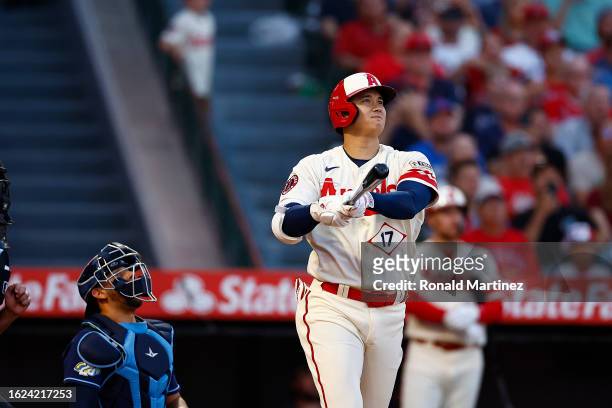 Shohei Ohtani of the Los Angeles Angels hits a grand slam against the Tampa Bay Rays in the second inning at Angel Stadium of Anaheim on August 18,...