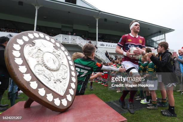 The Ranfurly Shield on display as Josh Bekhuis of Southland takes the field during the round three Bunnings Warehouse NPC match between Wellington...