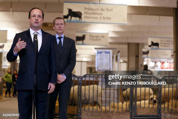 French President Francois Hollande , flanked by Junior Minister for Food Industry Guillaume Garot, delivers a speech as he visits the 50th...