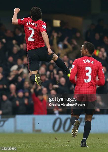 Rafael Da Silva of Manchester United celebrates scoring their first goal during the Barclays Premier League match between Queens Park Rangers and...