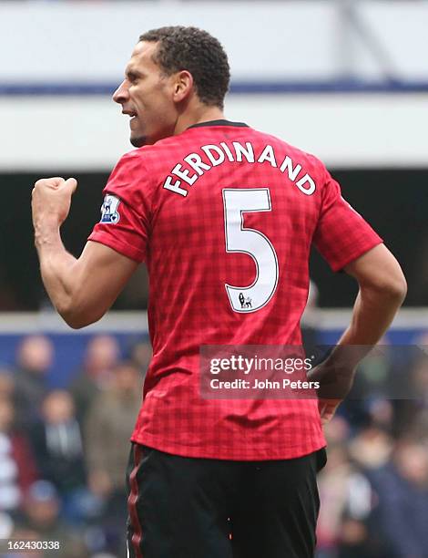 Rio Ferdinand of Manchester United celebrates Ryan Giggs scoring their second goal during the Barclays Premier League match between Queens Park...