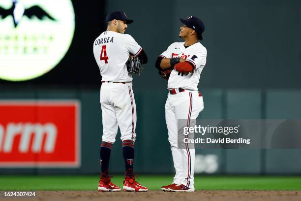 Carlos Correa and Jorge Polanco of the Minnesota Twins celebrate their victory against the Pittsburgh Pirates after the game at Target Field on...