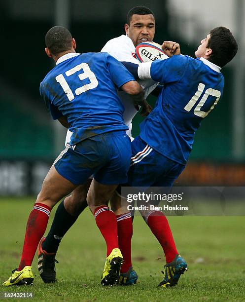 Danny Hobbs-Awoyemi of England is tackled by Gael Fickou and Vincent Mallet of France during the U20s RBS Six Nations match between England U20 and...