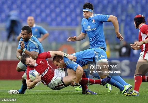 George North of Wales is tackled by Manoa Vosawai and Gonzalo Garcia of Italy during the RBS Six Nations match between Italy and Wales at Stadio...