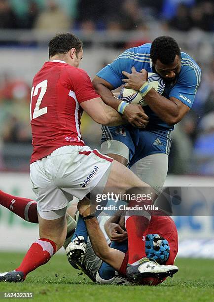 Manoa Vosawai of Italy is tackled by Jamie Roberts of Wales during the RBS Six Nations match between Italy and Wales at Stadio Olimpico on February...