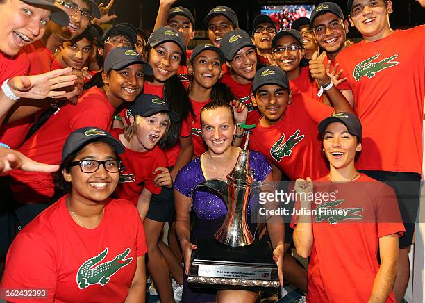 Petra Kvitova of Czech Republic with the trophy poses with ball boys and girls after defeating Sara Errani of Italy in the final during day six of...