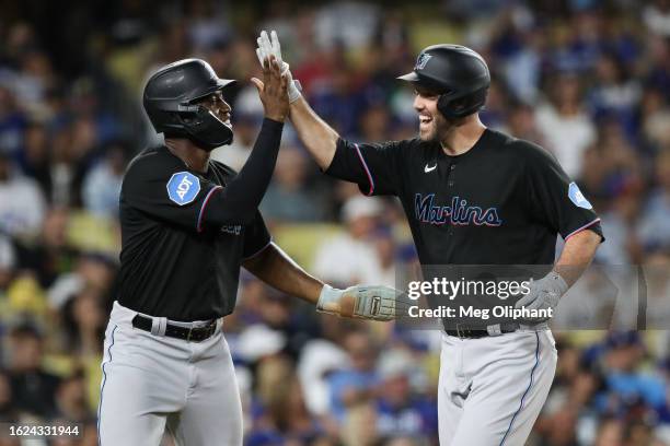 Jacob Stallings of the Miami Marlins celebrates after scoring a two-run home run in the third inning against the Los Angeles Dodgers at Dodger...