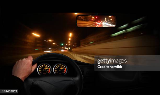 driver going very fast through the town - speed dial stock pictures, royalty-free photos & images