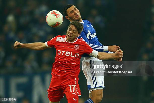 Andreas Lambertz of Duesseldorf and Sead Kolasinac of Schalke go up for a header during the Bundesliga match between FC Schalke 04 and Fortuna...