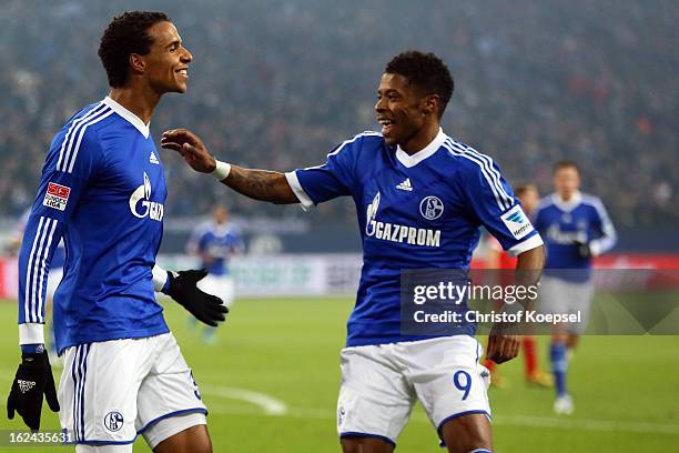 Joel Matip of Schalke celebrates the first goal with Michel Bastos of Schalke during the Bundesliga match between FC Schalke 04 and Fortuna...