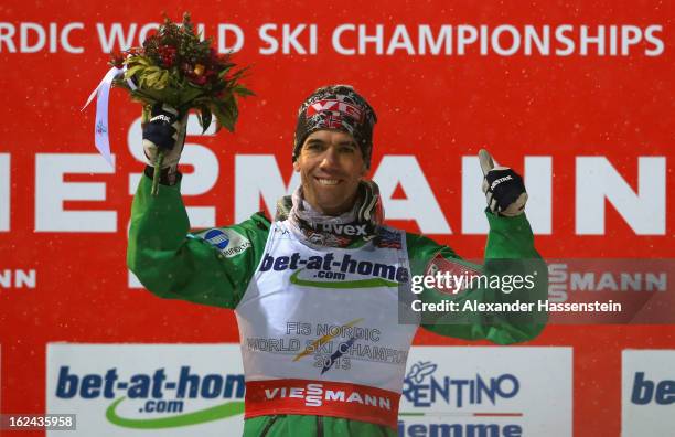 Anders Bardal of Norway celebrates victory on the podium following the Men's Ski Jumping HS106 Final Round at the FIS Nordic World Ski Championships...