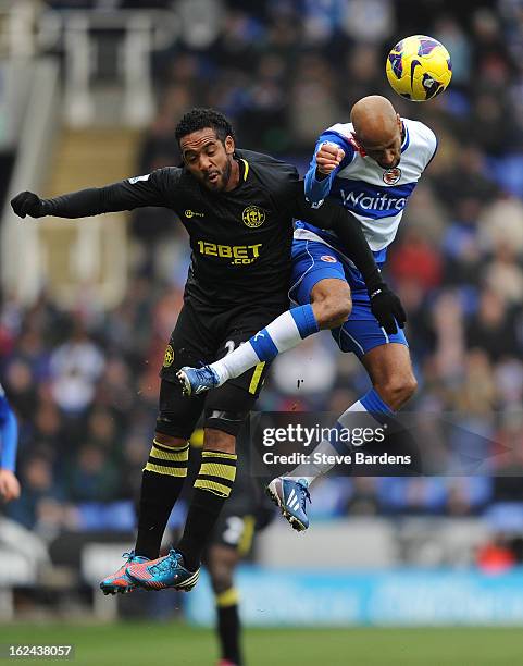 Jimmy Kebe of Reading wins a header from Jean Beausejour of Wigan Athletic during the Barclays Premier League match between Reading and Wigan...