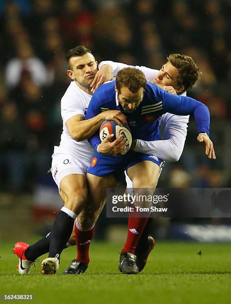 Frederic Michalak of France is tackled by Danny Care and Toby Flood of England during the RBS Six Nations match between England and France at...