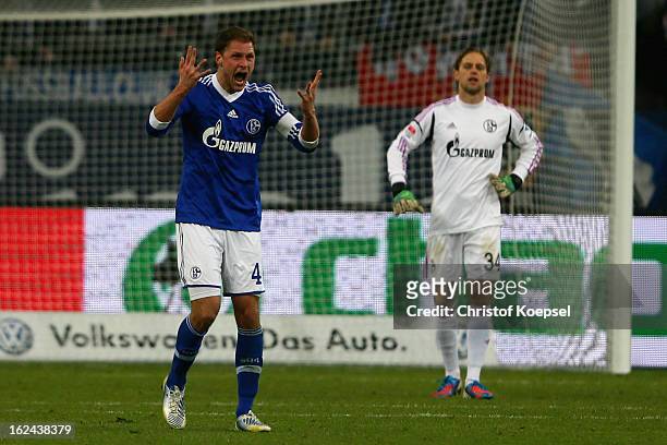 Benedikt Hoewedes and Timo Hildebrand of Schalke show their frustration after the first goal of Duesseldorf during the Bundesliga match between FC...