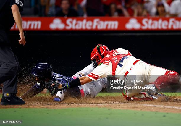 Logan O'Hoppe of the Los Angeles Angels makes the out against Yandy Diaz of the Tampa Bay Rays in the ninth inning at Angel Stadium of Anaheim on...