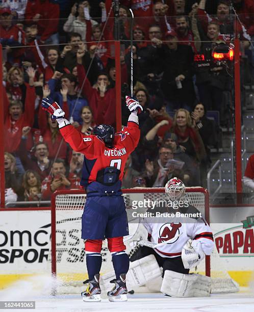 Alex Ovechkin of the Washington Capitals scores at 1:23 of the third period against Johan Hedberg of the New Jersey Devils at the Verizon Center on...