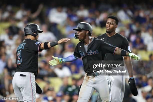 Jazz Chisholm Jr. #2 of the Miami Marlins celebrates with Luis Arraez after hitting a three-run home run in the fourth inning against the Los Angeles...