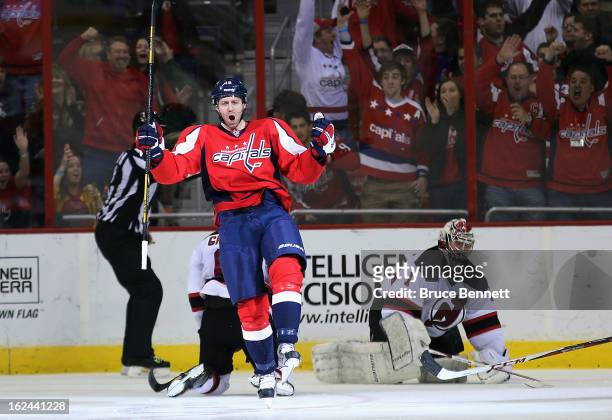 Eric Fehr of the Washington Capitals celebrates a shorthanded goal at 3:56 of the third period against Johan Hedberg of the New Jersey Devils at the...