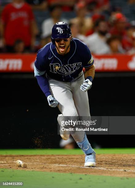 Josh Lowe of the Tampa Bay Rays after hitting a rbi single against the Los Angeles Angels in the tenth inning at Angel Stadium of Anaheim on August...
