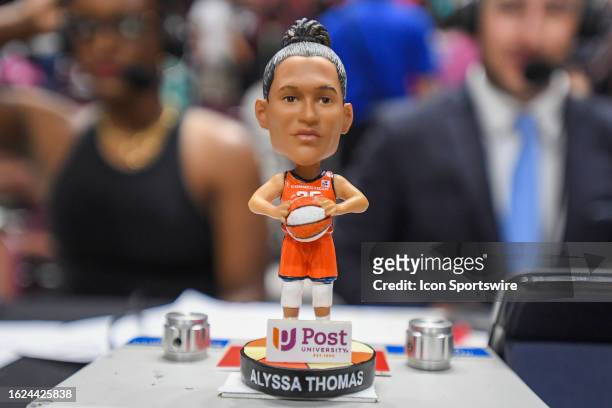 Detail view of a Connecticut Sun forward Alyssa Thomas bobblehead given to fans during a WNBA game between the New York Liberty and the Connecticut...