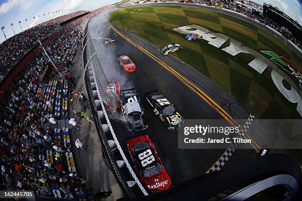 Dale Earnhardt Jr., driver of the TaxSlayer.com Chevrolet, Justin Allgaier, driver of the Brandt Chevrolet, Brian Scott, driver of the Shore Lodge...