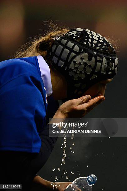 France's lock Sandra Rabier washes her face with water during the Six Nations women's international rugby union match between England and France at...