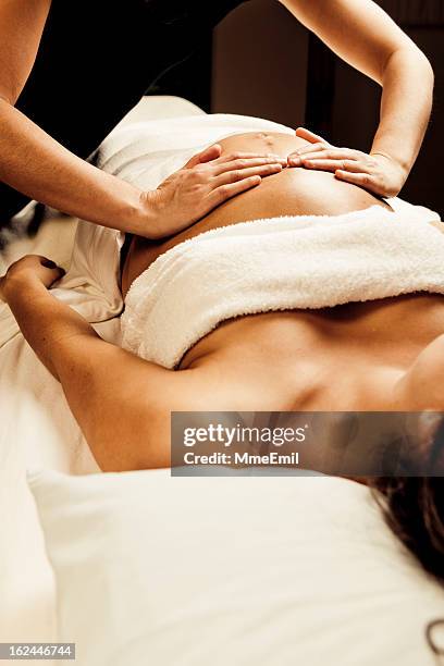 massage during pregnancy - massage therapy stock pictures, royalty-free photos & images