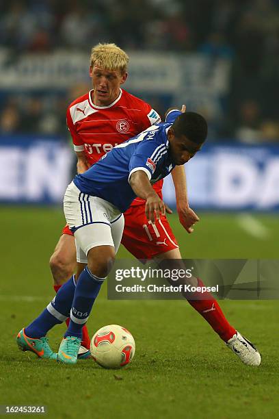 Axel Bellinghausen of Duesseldorf challenges Jefferson Farfan of Schalke during the Bundesliga match between FC Schalke 04 and Fortuna Duesseldorf at...