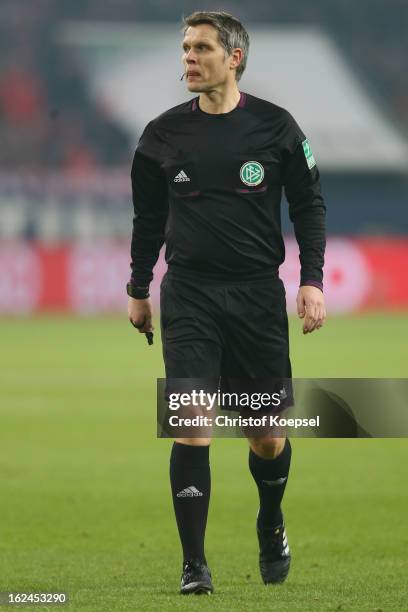 Referee Michael Weiner looks on during the Bundesliga match between FC Schalke 04 and Fortuna Duesseldorf at Veltins-Arena on February 23, 2013 in...