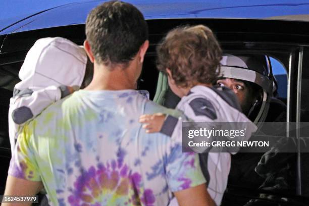 Astronaut Jasmin Moghbeli says goodbye to family members from a car as she departs the Neil A. Armstrong Operations and Checkout Building for Launch...