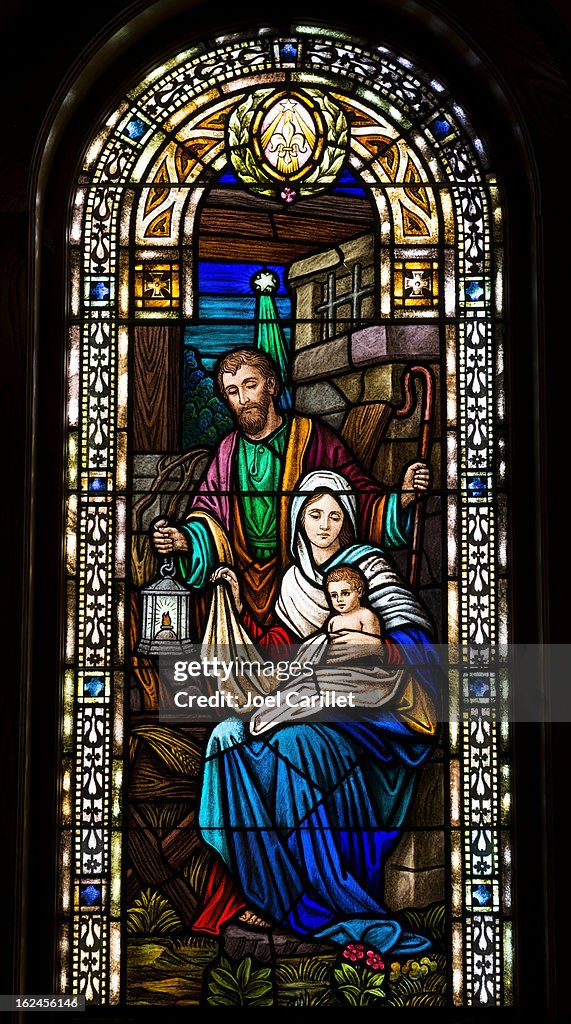 Joseph, Mary, and baby Jesus in stained glass