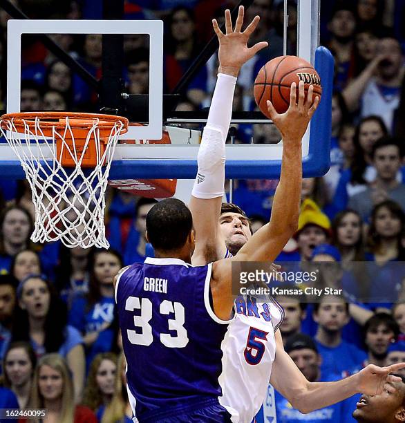 Kansas' Jeff Withey slaps down a shot by Texas Christian's Garlon Green during the first half at Allen Fieldhouse in Lawrence, Kansas, on Saturday,...