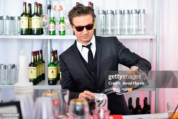 Jeremy Renner poses in the Kindle Fire HD and IMDb Green Room during the 2013 Film Independent Spirit Awards at Santa Monica Beach on February 23,...