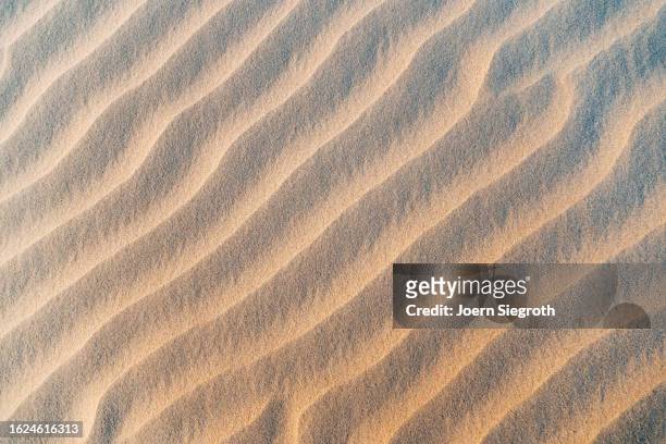 nature's artistry: intricate sand textures - sedimentary rock formation stock pictures, royalty-free photos & images