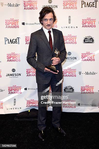 Actor John Hawkes poses with the Best Male Lead award for 'The Sessions' in the press room during the 2013 Film Independent Spirit Awards at Santa...