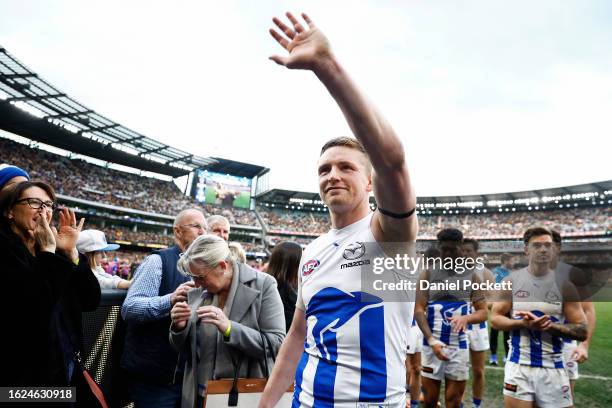 Jack Ziebell of the Kangaroos leaves the field after playing his final game during the round 23 AFL match between Richmond Tigers and North Melbourne...