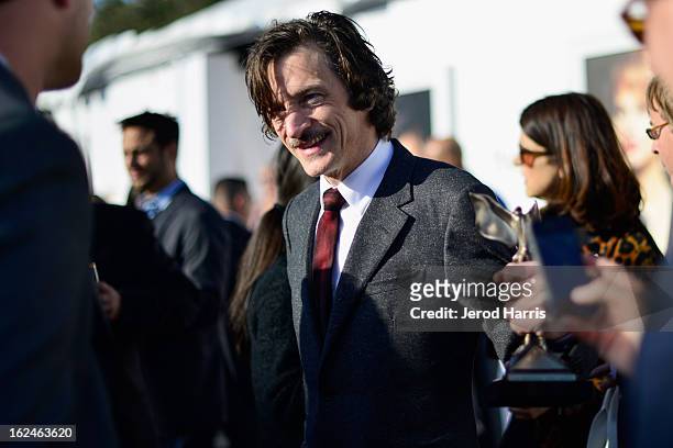 Actor John Hawkes poses in the Kindle Fire HD and IMDb Green Room during the 2013 Film Independent Spirit Awards at Santa Monica Beach on February...