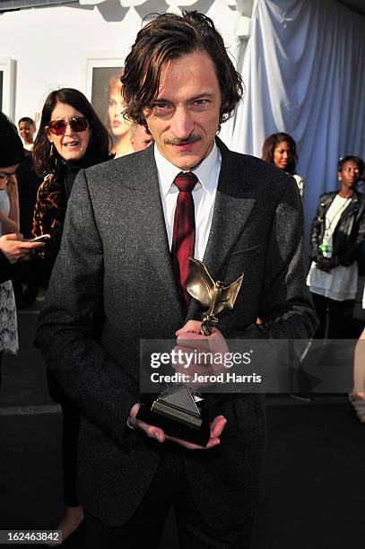 Actor John Hawkes poses in the Kindle Fire HD and IMDb Green Room during the 2013 Film Independent Spirit Awards at Santa Monica Beach on February...