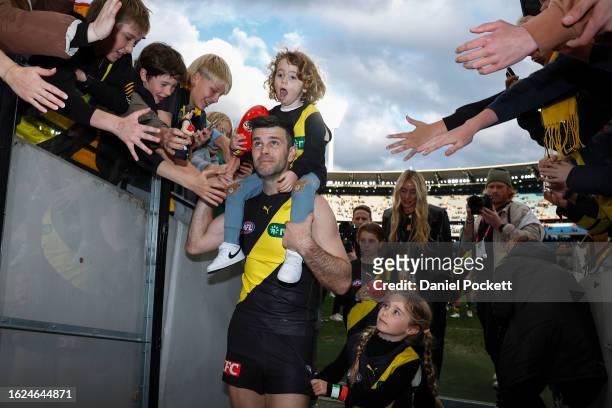 Trent Cotchin of the Tigers leaves the field after playing his final game during the round 23 AFL match between Richmond Tigers and North Melbourne...