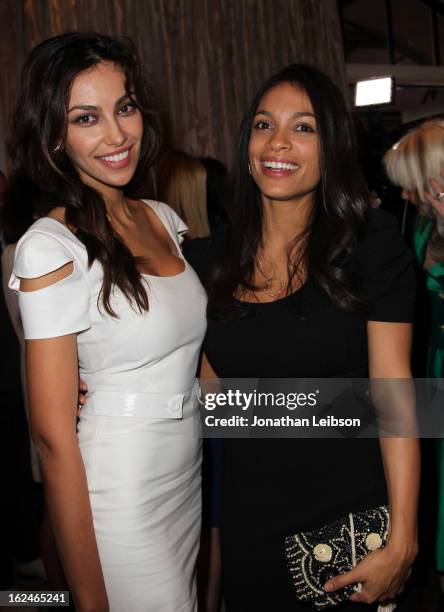 Madalina Ghenea and Rosario Dawson wearing Montblanc Star 4810 in Yellow Gold attend a Pre-Oscar charity brunch hosted by Montblanc and UNICEF to...