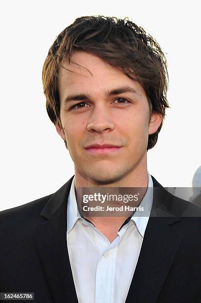 Johnny Simmons poses in the Kindle Fire HD and IMDb Green Room during the 2013 Film Independent Spirit Awards at Santa Monica Beach on February 23,...