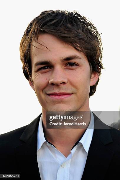 Johnny Simmons poses in the Kindle Fire HD and IMDb Green Room during the 2013 Film Independent Spirit Awards at Santa Monica Beach on February 23,...