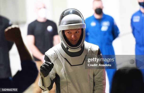 Crew-7 member Roscosmos cosmonaut Konstantin Borisov greets family members after walking out of the Neil A. Armstrong Operations and Checkout...