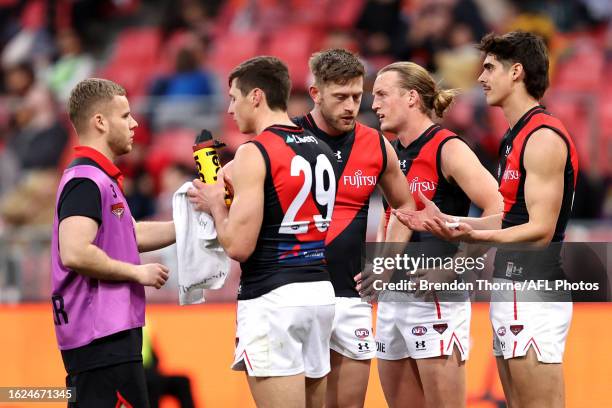 Bombers players react during the round 23 AFL match between Greater Western Sydney Giants and Essendon Bombers at GIANTS Stadium, on August 19 in...