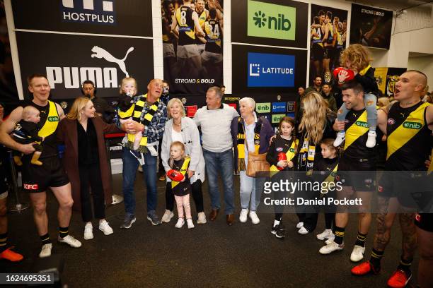 Jack Riewoldt of the Tigers and Trent Cotchin of the Tigers sing the team song after winning the round 23 AFL match between Richmond Tigers and North...