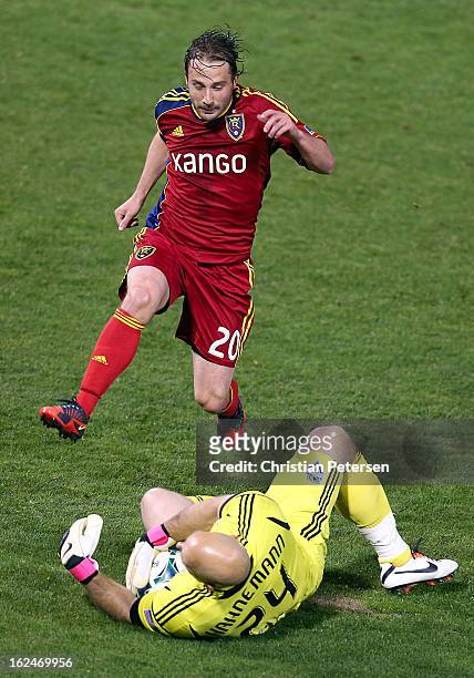 Ned Grabavoy of Real Salt Lake has his shot blocked by goalkeeper Marcus Hahnemann of the Seattle Sounders as he attempts to score during the first...