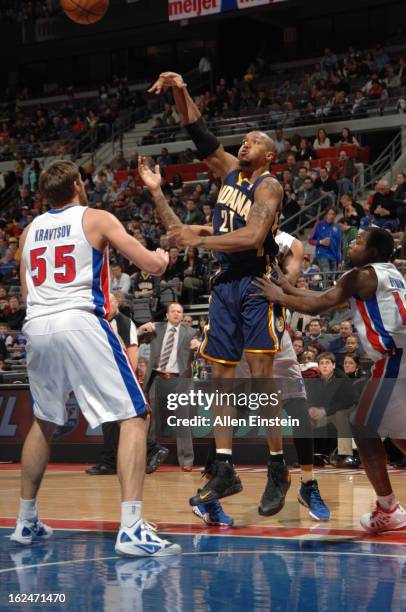 David West of the Indiana Pacers passes the ball against Viacheslav Kravtsov of the Detroit Pistons on February 23, 2013 at The Palace of Auburn...