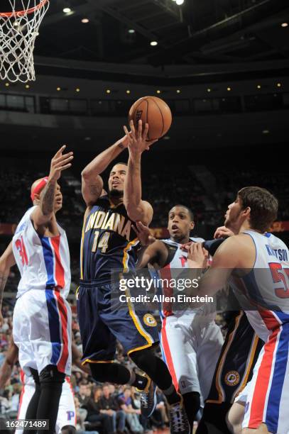 Augustin of the Indiana Pacers goes to the basket agaionst Charlie Villanueva, Khris Middleton, and Viacheslav Kravtsov of the Detroit Pistons on...