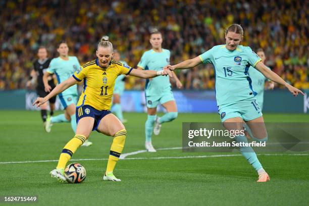 Stina Blackstenius of Sweden shoots at goal while Clare Hunt of Australia attempts to block during the FIFA Women's World Cup Australia & New Zealand...