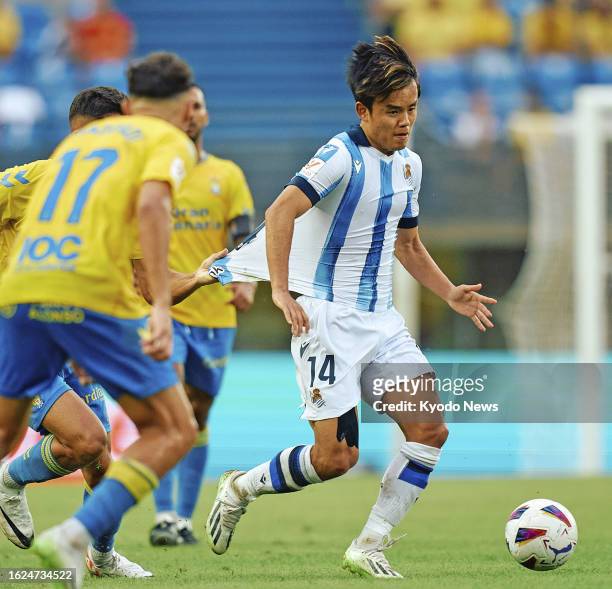Takefusa Kubo of Real Sociedad dribbles the ball in a Spanish La Liga football match against Las Palmas on Aug. 25 in Las Palmas.
